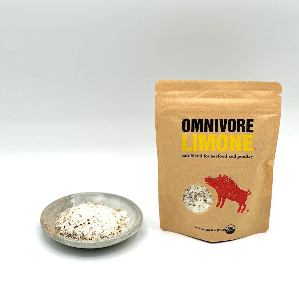 This photo has 1 -hand crafted, small, white and grey ceramic dish. + 1- 6 oz bag of  Omnivore Limone.